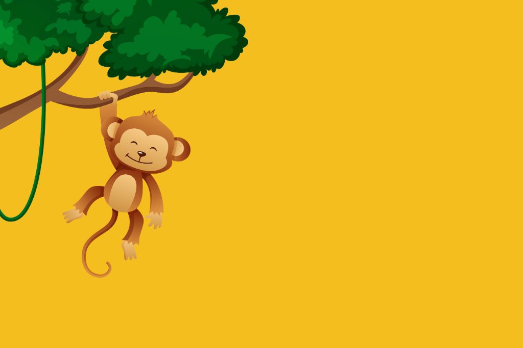 a monkey hanging from the brand of a tree